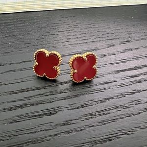 Red four leaf clover design earring with gold rim